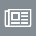 White newspaper icon with a large square and horizontal lines on a gray background, symbolizing news or journalism.