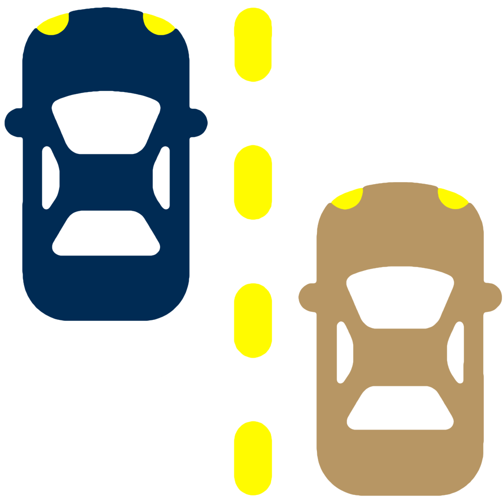 Two cars, one blue and one brown, are driving side by side in separate lanes divided by a dashed yellow line on a road.