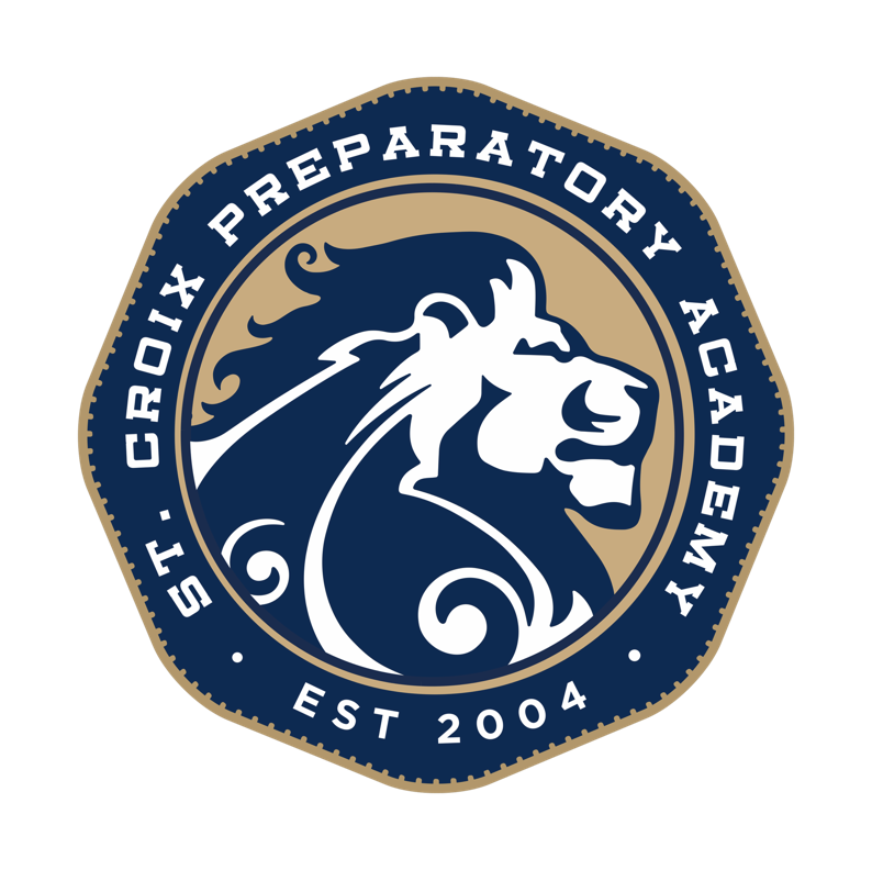 A circular emblem featuring a stylized lion’s head in profile, surrounded by the text “St. Croix Preparatory Academy” and “Est 2004” on a blue and gold background.